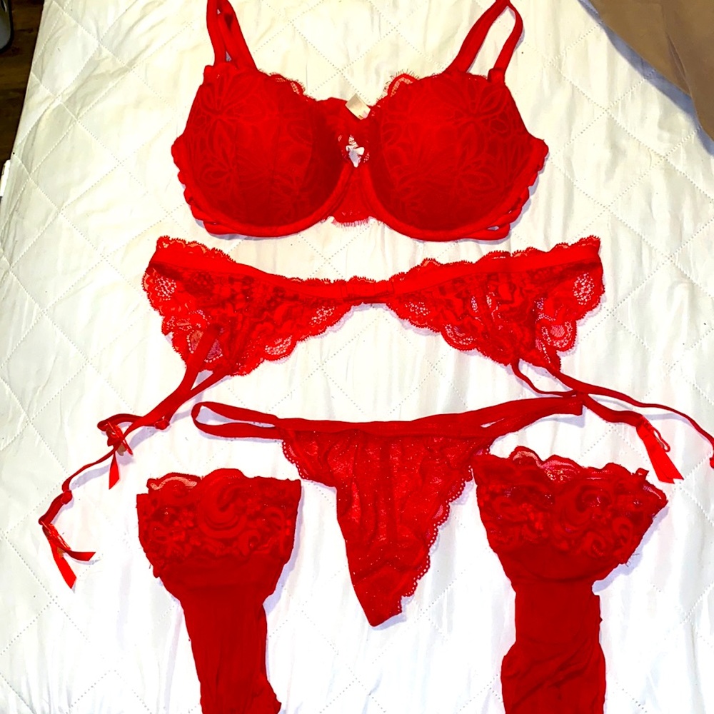 Red Victoria’s Secret lingerie set. G string, bra, stockings, garter belt.